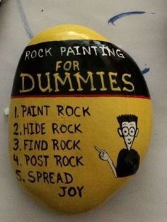 rock painting for dummies painted on a yellow and black pinback with instructions