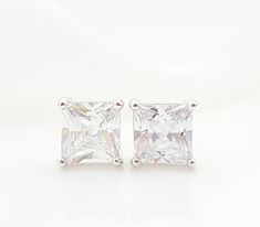 "These CZ stud earrings are made with 9.5mm square cubic zirconia stones, set in rhodium bezels with Sterling silver posts. These big, diamond-like earrings make lovely jewelry gifts for her. Thank you for looking. - Shop Gemsicles, an Etsy boutique with hundreds of sparkly items for weddings, gifts and just because. Our original jewelry designs feature gemstones, Swarovski® crystals, pearls, CZs, vintage components, porcelain & dried flowers, lampwork glass, rhinestones, precious metals and Square Cut Cubic Zirconia Earrings For Wedding, Square Cut Cubic Zirconia Wedding Earrings, Classic Rectangular Cubic Zirconia Earrings, Square Cut Cubic Zirconia Earrings For Anniversary, Diamond White Rectangular Earrings For Wedding, Diamond White Rectangular Wedding Earrings, Wedding Diamond White Rectangular Earrings, Square Cubic Zirconia Wedding Jewelry, Rectangular White Gold Cubic Zirconia Earrings