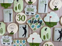 decorated cookies are arranged in the shape of golf related items