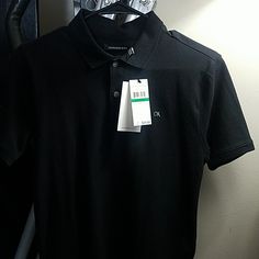 Nwt Calvin Klein Polo Short Sleeve Shirt With A Collar And Two Buttons Black With A Grey "Ck" Symbol Boys Size Large 14-16 *Original Price $34.50* Tommy Hilfiger Polo Shirt, Ck Jeans, Tommy Hilfiger Polo, Blue Polo Shirts, White Polo, Pique Polo Shirt, White Boys, T Shirt And Shorts, Boys T Shirts