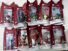 there are many action figures on display in the package bags for sale at toys r us