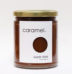 a jar of caramel is shown on a white background