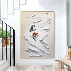 two skiers skiing down a snowy hill in the snow framed print on wall above stairs