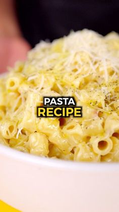 pasta in a white bowl with parmesan cheese on top