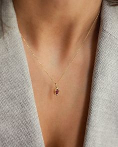 Description Elevate your jewelry collection with our Oval Ruby Pendant Necklace, a timeless piece signed for the woman who appreciates minimalist elegance. The necklace features a captivating oval-cut ruby, securely bezel set in 14k solid gold. With its clean lines and impeccable craftsmanship, this necklace effortlessly enhances any look, from formal to casual. Details * 4x6mm oval cut ruby * 14K solid gold * Chain length: 40cm + 3cm (16" + 1.18") * Ready to ship in 14K yellow gold Processing t Elegant Oval Pendant Birthstone Necklace, Minimalist Oval Pendant Birthstone Jewelry, Timeless Oval Pendant Gemstone Necklace, Refined Oval Pendant Necklace As Gift, Minimalist Birthstone Necklace For Formal Occasions, Elegant Oval Birthstone Necklace, Minimalist Formal Birthstone Necklace, Polished Finish Oval Cabochon Necklace, Minimalist Oval Jewelry With Bezel Setting