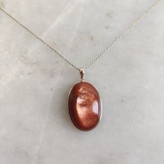 This stunning Pendant is set in 14k Solid Yellow Gold with Natural Sunstone (Feldspar Crystal) with utmost precision. It is a unique gemstone Pendant for nearly every occasion and is completely hassle-free jewelry. ITEM DETAILS: *  GEM: Sunstone * GEM SIZE: 18x27mm * GEM SHAPE: Oval * Gem WEIGHT: 36.83 carats * Gold Purity: 14KT * Gold Weight: 0.75 gram * Total Weight: 8.13 gram The Gold purity is guaranteed and it comes with authentic 14KT gold hallmark. Since my items are handmade, they are absolutely nickel and lead free. CUSTOMIZATION: * Gemstone customization is available and it can be substituted with a gem of your choice. Kindly message me for the same. PACKAGING * The Pendant comes with layers of safe and secure wrapping along with Free handmade jewelry box with every purchase. ➡️H 14k Gold Oval Amber Jewelry, Elegant Oval Amber Gemstones, Elegant Gold Natural Gemstones, Polished 14k Gold Amber Jewelry, 14k Gold Amber Jewelry With Polished Finish, Luxury 14k Gold Amber Jewelry, Gold Gemstones With Bezel Setting In Fine Jewelry, High Luster Oval Gemstones For Gifts, Gold Round Gemstones With Polished Finish