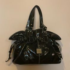 Dooney & Bourke Brand New Never Used Black Soft Patent Leather Bag Measures Approx H 11” X L 14” X D 6” Adjustable Straps Approx 9” Drop Magnetic Snap Closure One Zip Pocket One Slip Pocket Three Compartments Silver Hardware Dust Bag Great Roomy Bag For Travel, Cruise, Etc This Item Is Not Included In The Bundle Offer Medium Size Bags Handbags, Navy Handbag, Travel Cruise, Dooney & Bourke Bag, Brown Satchel, Patent Leather Bag, Patent Leather Handbags, Bag For Travel, Black Satchel