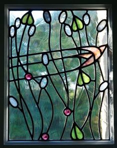 a stained glass window with flowers on it