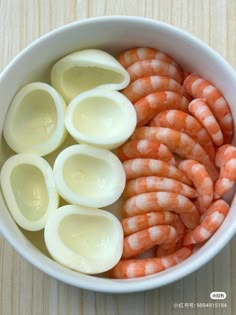 peeled shrimp and hard boiled eggs in a bowl