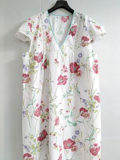 Oversized 100% Cotton Nightgown Flower Print 4XL - women giift This nightgow has a very elaborate design, but at the same time very comfortable. This cotton is the softest against the skin, washes beautifully without the usual wrinkling and is light weight. Perfect for lounge wear or sleep. Simple V scoop neckline with lace.  Size is chosen by bust measured at fullest which is all the way around and across the center of bust (not bra size) and length is measured from shoulder down, over the bust, to the length you want. Plus size it is any measurement, bust, waist, hips that measure over 48". Dimensions of dress: bust - 52 inch (132 cm),  robe length 47 inch (120cm) Shipping time: please see the shop policies for a full shipping information: https://www.etsy.com/shop/VikiSleepLine/policy?r Cotton Floral Print V-neck Sleepwear, Floral Print Short Sleeve Sleepwear, Short Sleeve Floral Print Sleepwear, Feminine Short Sleeve Sleepwear With Lace Trim, Feminine Lace Trim Short Sleeve Sleepwear, Feminine White Nightgown With Short Sleeves, Cotton V-neck Sleepwear With Floral Print, Spring Short Sleeve Sleepwear For Home, Spring Sleepwear With Short Sleeves For Home