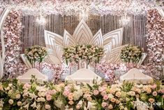 an elaborate floral display with white and pink flowers