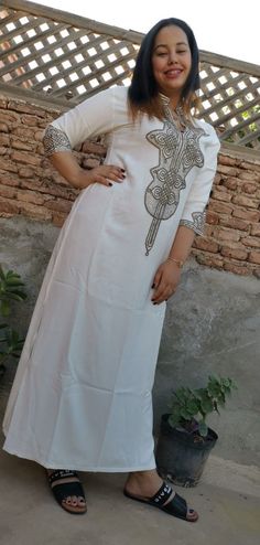 this stunning embroidered Moroccan kaftan is beautifully handcrafted by high skilled artisans from Morocco . both embroidery and beading are handmade . the fabric is so soft and comfy what makes it comfortable and elegant at the same time. this moroccan dress is easy to wear and will turn heads at any occasion, weddings, eid, baby shower, Ramadan ..etc *Product Describe Dress Style : kaftan THANK YOU VISIT AGAIN Traditional Long Kaftan, White Ceremonial Maxi Kaftan, White Ceremonial Maxi Length Kaftan, Traditional Long Fitted Kaftan, Traditional Fitted Long Kaftan, White Maxi Length Kaftan For Ceremonial Occasion, Traditional Fitted Maxi Length Kaftan, Traditional Hand Embellished Gown For Ceremonies, Traditional Floor-length Kaftan For Ceremonial Occasions