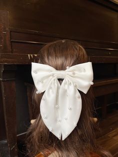 "Material Satin fabric, alligator clip, comb, faux pearl Description Bow size: width 6.75\", high 3.5\" Tails size: 7\" long Comb size: 2.5\" Alligator clip size: 2.5\" custom orders welcome, please contact me! Current processing time is 1-3 business days before shipping. SHIPPING: All US orders are shipped USPS First Class Flat mailer with tracking information. Thank you for taking your time to visit Twin craft store. I hope you find something you love even for your family." Pearl Hair Bow, Satin Hair Bow, Pearl Bridal Hair, Date Hairstyles, Pearl Hair Comb, Diy Hair Scrunchies, Pearl Hair Combs, Bow Women, Pearl Bow