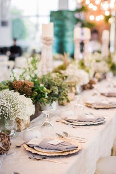 the table is set with plates and silverware