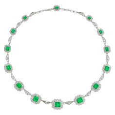 A fine Vintage emerald and diamond necklace, the fourteen octagonal-cut emeralds estimated to weigh 17 carats in total, the ten larger of Colombian origin, each surrounded by scalloped-edge frame set with old European-cut diamonds, connected with fourteen openwork links of triangular shape, each set with an old European cut diamond, the diamonds estimated to weigh 14.5 carats in total, all millegrain-set in platinum mount, circa 1950, accompanied by four openwork links of rectangular shape that Vintage Diamond Necklace, Diamond Cluster Necklace, Emerald And Diamond Necklace, Back Extension, Her Majesty The Queen, Cluster Necklace, Colored Stones, Expensive Jewelry, European Cut Diamonds