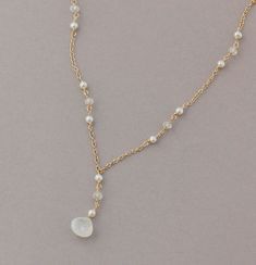 Moonstone and Pearl Necklace, Gold or Silver, Rainbow Moonstone, Y Necklace, Beach Wedding Jewelry, Beachy Bridal Necklace A dainty Y necklace featuring a luminous rainbow moonstone as the focal point. Small luminous freshwater pearls and small rainbow moonstones are meticulously wired by hand in between fine gold filled chain to create sparkle throughout the necklace and catch the light beautifully. Available in several lengths. Also available in sterling silver or rose gold filled. This n... Beach Wedding Jewelry, Gold Pearl Necklace, Bridal Necklace, Moon Stone, Gold Filled Chain, Rainbow Moonstone, Moonstone, Beach Wedding, Freshwater Pearls