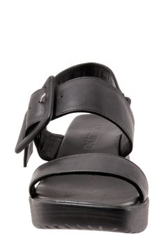 An oversized buckle accents the leather strap of an elegant square-toe sandal resting on a chunky wedge sole. 2 1/4" heel Cushioned footbed Leather upper and lining/rubber sole Made in Turkey