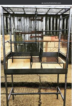 a metal bed frame sitting on top of a wooden floor next to a fence and building