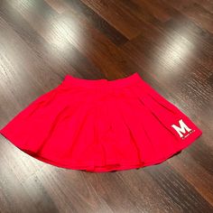 Such A Cute Red Skirt For Gamedays At University Of Maryland! Never Worn And Has Tags On It! Red Skirt With Elastic Waistband For Spring, Red Cotton Flared Skirt Bottoms, Red Flared Cotton Skirt, Red Cotton Flared Skirt, Red Bottoms For Cheerleading In Summer, Red Skirt With Elastic Waistband, Red Stretch Tennis Skirt, Red Stretch Casual Mini Skirt, Red Stretch Mini Skirt Casual