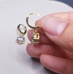 About 2 cm in length. Solid 14k gold posts. Especially good for people with metal allergies. Minimalist Single Gold Crystal Earring, Gold Cubic Zirconia Clip-on Earrings For Gift, Tarnish Resistant Cubic Zirconia Fine Earrings, Gold Hoop Drop Earrings With Prong Setting, Gold Teardrop Huggie Earrings In Cubic Zirconia, Gold Dangle Diamond Earrings In 14k, Gold Dangle Diamond Earrings For Pierced Ears, Gold Dangle Diamond Earrings, Gold Teardrop Huggie Earrings With Cubic Zirconia