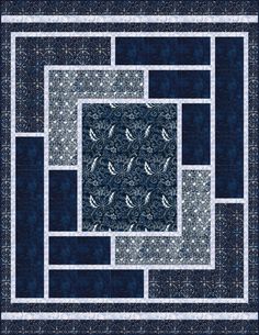 a blue and white quilt with an intricate design