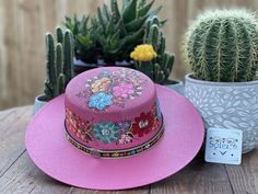 "This beautiful Mexican Hat is stylish and is completely unique in design, perfect to add that special touch to any outfit. This structured palm hat is often referred to as a women \"boater\" hat with its flat crown. The wide brim is accented by a hand painted band. The hat itself is made out of high quality jute and is very light and breathable. It is handmade and hand painted by Mexican Artisans in Mexico." Multicolor Short Brim Hat For Rodeo, Pink Wide Brim Hat As A Gift, Multicolor Curved Brim Sun Hat For Rodeo, Pink Bohemian Sun Hat For Kentucky Derby, Bohemian Pink Sun Hat For Kentucky Derby, Multicolor Flat Brim Sun Hat For Kentucky Derby, Multicolor Bohemian Straw Hat For Kentucky Derby, Bohemian Multicolor Straw Hat For Kentucky Derby, Multicolor Western Hats For Kentucky Derby