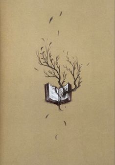 an open book sitting on top of a tree filled with leaves and birds flying around