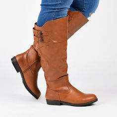 Step into must-have boots this season with riding boots by Journee Collection. These boots have richly colored faux leather uppers that rise to the knees with raised vamps. A roomy design in the calves creates an extra-wide calf style. At Journee Collection, our boot styles will have your outfit looking even better than before. They will give you that finishing touch that will have your outfit looking straight out of a magazine. Brown Knee-high Boots For Fall, Brown Wide Calf Knee-high Boots, Fall Wide Calf Knee-high Boots, Fall Knee-high Moto Boots Medium Width, Knee-high Faux Leather Boots For Fall, Fall Medium Width Knee-high Moto Boots, Fall Knee-high Wide Calf Boots, Wide Calf Faux Leather Knee-high Boots, Wide Calf Knee-high Faux Leather Boots