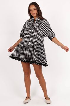 DETAILS  Designed for the fashion-forward woman who appreciates both comfort and style, this mini dress is a versatile addition to your wardrobe. Whether you're pairing it with sandals for a casual day out or dressing it up with heels for a chic evening look.    mini length  high round neckline  short sleeves  functional button down  ric rac trim on hem  gingham print  unlined  material - 100% cotton    SIZING     model is 5' 7" and wears a Size S    model stats: bust - 33", waist - 26", hips - Casual Gingham Mini Dress, Casual Gingham Cotton Mini Dress, Chic Short Sleeve Gingham Mini Dress, Black Cotton Plaid Mini Dress, Black Plaid Cotton Mini Dress, Satin Dresses Long, Satin Dresses Long Sleeve, Black Tie Wedding Guests, White Dress Shoes