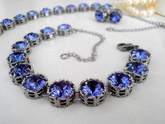 Handmade Tanzanite Filigree Choker Necklace/Bracelet/Stud Pierced Earrings. Art Deco Style Swarovski Crystal Necklace made with Authentic Swarovski Crystal Elements. Great Sparkle * Choose your pattern from drop down menu Also available in many other Crystal Colors, just email me for more information** Nickel Lead Free * Perfect for Bridesmaid gift too ** Crystal Color: Swarovski Tanzanite Blue. * Helpful tips for proper care: To avoid damaging or dulling Costume Jewelry, do not use jewelry clea Elegant Formal Tanzanite Necklaces, Luxury Tanzanite Necklace For Women, Elegant Blue Tanzanite Necklace, Blue Crystal Necklace Costume Jewelry, Classic Tanzanite Multi-stone Jewelry, Blue Choker, Swarovski Crystal Necklace, Anniversary Gifts For Wife, Bohemian Jewelry