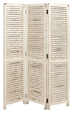 an old white room divider with shutters on the sides and one section open