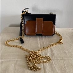 Nwt Case-Mate Leather Gold Chain Bag Or Wristlet I Had This For A Couple Of Years And Never Used It. It’s A Small Wallet W/ A Detachable Gold Chain. Has A Snap Closure On The Outside That Was Made For A Smaller Phone. The Inside Has An Id Slip Pocket W/ 2 Credit Card Pockets. A Snap Coin Pocket As Well As 2 Slip Pockets Inside. Also, 1 Slip Pocket On The Outside. It Can Also Be Used As A Wristlet. Zipper Opening. Comes With Dust Bag. Approximate Measurements 3.5 X 5.2” Chain Drop 26” Gold Leather Box Bag With Mobile Phone Holder, Gold Leather Mobile Phone Box Bag, Black Clutch Box Bag As Fashion Accessory, Versatile Brown Rectangular Clutch, Evening Bags With Metal Hardware In Brown, Brown Formal Wallet With Gold-tone Hardware, Brown Evening Bags With Metal Hardware, Formal Brown Wallet With Gold-tone Hardware, Formal Brown Wallets With Gold-tone Hardware