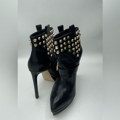 Elevate Your Shoe Game With These Exquisite Michael Kors Bryn Studded Platform Booties Size 7 In A Timeless Black Leather Finish Accented By Gleaming Golden Hardware. These Preowned Beauties Are Not Just Shoes; They're A Fashion Statement Waiting To Be Made. With A Classic Yet Chic Almond Toe And A Decorative Buckle On The Front, These Booties Exude Sophistication And Style. The Studded, Short Shaft Adds A Touch Of Edginess Toyour Ensemble. Key Features: Crafted From High-Quality Calf Leather Wi Leather Finish, Camera Flash, 5 Inch Heels, Michael Kors Shoes, Michael Kors Black, Shoe Game, Bootie, Effortless Style, Fashion Statement