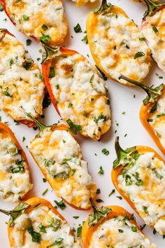 stuffed bell peppers with cheese and herbs on a white plate, ready to be eaten