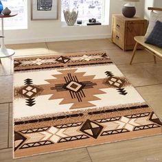 a living room area with a rug and chairs