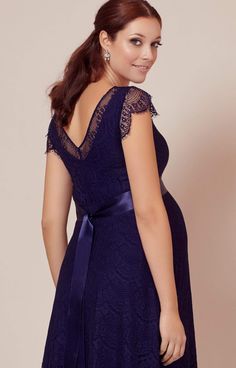 A fun and flirty take on our floor sweeping gown by the same name, our Kristin maternity dress has the same A-list glamour, romantic sweetheart neckline and exquisite eyelash lace from head to toe. •Deep indigo blue eyelash lace •Vintage-feel with satin-edged sweetheart neckline •Scalloped eyelash edge cap sleeve •Subtle stretch to grow with you •Baby-soft premium jersey lining •Pretty sheer cap sleeve and neckline •Flattering swishy knee length skirt •Lovingly designed and made in Britain Elegant Blue Maternity Gown, Elegant Maternity Wedding Dress With Lace Trim, Elegant Wedding Maternity Dress With Lace Trim, Elegant Maternity Dresses With Scalloped Lace, Elegant Maternity Lace Dress With Lace Trim, Maternity Dresses With Sweep Train, Blue Empire Waist Dress With Lace Trim, Elegant Maternity Dress With Sweetheart Neckline, Elegant Maternity Dress With Lace Trim