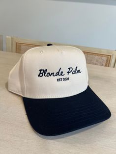 The perfect summer beach hat! This trucker hat is navy/natural with navy thread. Summer Beige Baseball Cap With Flat Brim, Navy Flat Brim Hat For Beach, Navy Snapback Trucker Hat For Summer, Navy Adjustable Baseball Cap For Summer, Adjustable Navy Baseball Cap For Beach, Navy Summer Baseball Cap, Summer Cream Snapback Baseball Cap, Navy Snapback Hats For Beach, Summer Cream Trucker Cap