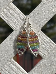 These lovely and unique earrings are made with silver plated framing and are wire wrapped with silver plated wire. The gemstone beads used for these earrings include the following: 3.5mm peach moonstone, 3mm labradorite, 2mm garnet, 3mm citrine, 3mm amethyst, 3mm peridot, 3.5mm blue apatite, 2.5mm ruby, and 2mm rainbow moonstone! They hang on sterling silver ear wires.  These earrings measure approximately 1.5-0" long from the ear wire down. Please view the photo of them next to a quarter for si Bohemian Silver Wire Wrapped Earrings, Bohemian Silver Plated Wire Earrings For Jewelry Making, Bohemian Sterling Silver Wire Wrapped Earrings, Bohemian Silver-plated Drop Earrings, Bohemian Silver Plated Drop Earrings, Bohemian Silver Hand Wrapped Earrings, Hand Wrapped Silver Bohemian Earrings, Bohemian Sterling Silver Wire-wrapped Crystal Earrings, Bohemian Sterling Silver Wire Wrapped Crystal Earrings