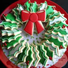 decorated christmas cookies on a red plate