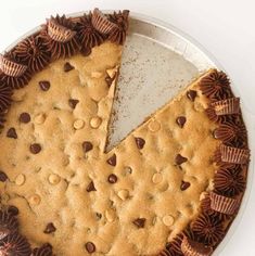 a chocolate chip cookie pie with one slice cut out and ready to be served on the table