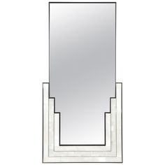 a mirror that is sitting on top of a shelf with three mirrors in it's sides