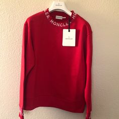 Grand New Moncler Red Round Neck Jumper Logo Sweatshirt. Size: Small Crew Neckline Long Sleeves With Logo Hem Hits Below The Hip. Pullover Style. Regular Fit Cotton Base. Wash Max 30c Shoulders: 19” Sleeve: 23” Breast: 20” Waterfall: 18” Length:65 “ Price Is Firm. Designer Red Long Sleeve Tops, Designer Long Sleeve Red Top, Designer Red Crew Neck Top, Designer Red Tops For Fall, Moncler Sweater, Logo Sweatshirt, Pullover Styling, Crew Neckline, Scoop Neck