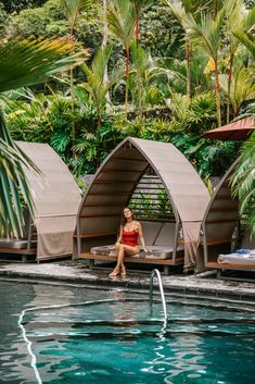 a woman sitting on the edge of a swimming pool with text overlay reading top things to do in la fortuna costa rica