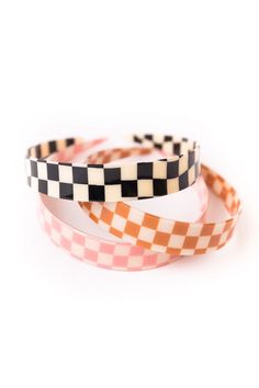 Need a new retro accessory? Look no further! The Dial Up Checkered Headband comes in three funky colors, perfect for any look. Wear them on a bad hair day or simply because you need some added style! Your summer looks just got a whole lot cuter! Trendy Multicolor Headband, Trendy Pink Hair Accessories For Summer, Trendy Black Hair Accessories For Summer, Summer Multicolor Adjustable Hair Accessories, Trendy Multicolor Summer Hair Accessories, Adjustable Fun Multicolor Hair Accessories, Trendy Adjustable Pink Headband, Fun Adjustable Hair Accessories For Summer, Trendy Pink Headband Hair Accessories