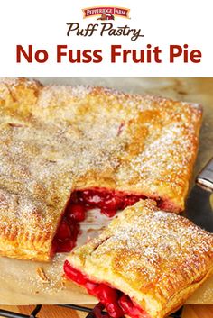 a piece of pie on a cutting board with the words puff pastry no fuss cherry pie