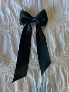 Handcrafted coquette style bow hair clip. Each bow is hand made and unique. It's perfect for any occasion from birthdays, proposals, for bridesmaids, or for day to day wear. These bows also make great gifts!  Bow Details: - You will receive one bow clip  - The clip is 3" long - The bow is 3.5" wide - The tail is 8.5" long - The bow has a silver alligator clip backing  - Forest green satin ribbon More about me: I am a men's and womenswear fashion designer who specialized in women's luxury fashion. Please go check out my Instagram and DM me or email me for any custom requests.  🖤Follow me @jozyelizabethlopaze on instagram  🖤Email me at jozylopaze@gmail.com Decorative Bow Headband For Party, Party Headband With Decorative Bow, Satin Bow Headband For Party, Elegant Ribbon Bow Headband, Formal Bow Headband, Formal Hair Accessories With Bow, Elegant Bow Hair Accessories As Gift, Elegant Hair Accessories With Satin Bow As Gift, Elegant Satin Bow Hair Accessories Gift