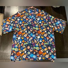 Men’s Large Nwt Disney Passholder Exclusive Pixar Fest Button Down Shirt Casual Blue Shirt With Cartoon Print, Summer Short Sleeve Shirt For Disney Fan Events, Disney Multicolor Character Print Shirt, Fun Blue Shirt With Cartoon Print, Multicolor Disney Character Print Shirt, Casual Blue Shirt With Character Print, Fun Printed Blue Shirt, Fun Blue Printed Shirt, Disney Graphic Print Blue Shirt