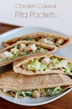 chicken caesar pita pockets on a white plate