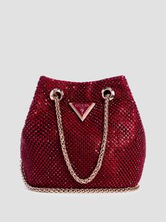 Rhinestone mesh pouch Shiny gold-tone hardware Enameled triangle logo Multiple interior pockets Chain drawstring closure Top handle with 2.75" drop. Detachable shoulder strap with 23.5" drop. 7"W x 4.25"H x 2.25"D Pretty Purses, Mesh Pouch, High Fashion Outfits, Guess Handbags, Handbag Heaven, Looks Black, Triangle Logo, 2024 Vision, Cute Bags