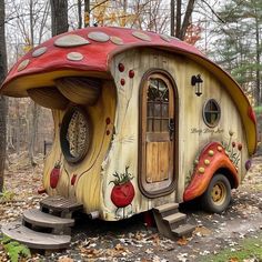 a house made out of wood with a red roof and mushroom like design on the side